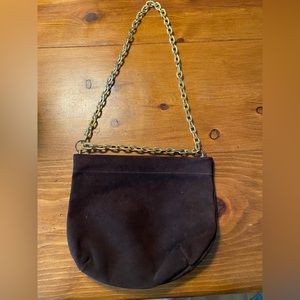 Vintage, suede purse, gold chain strap.Opens closes with pushing and pulling.